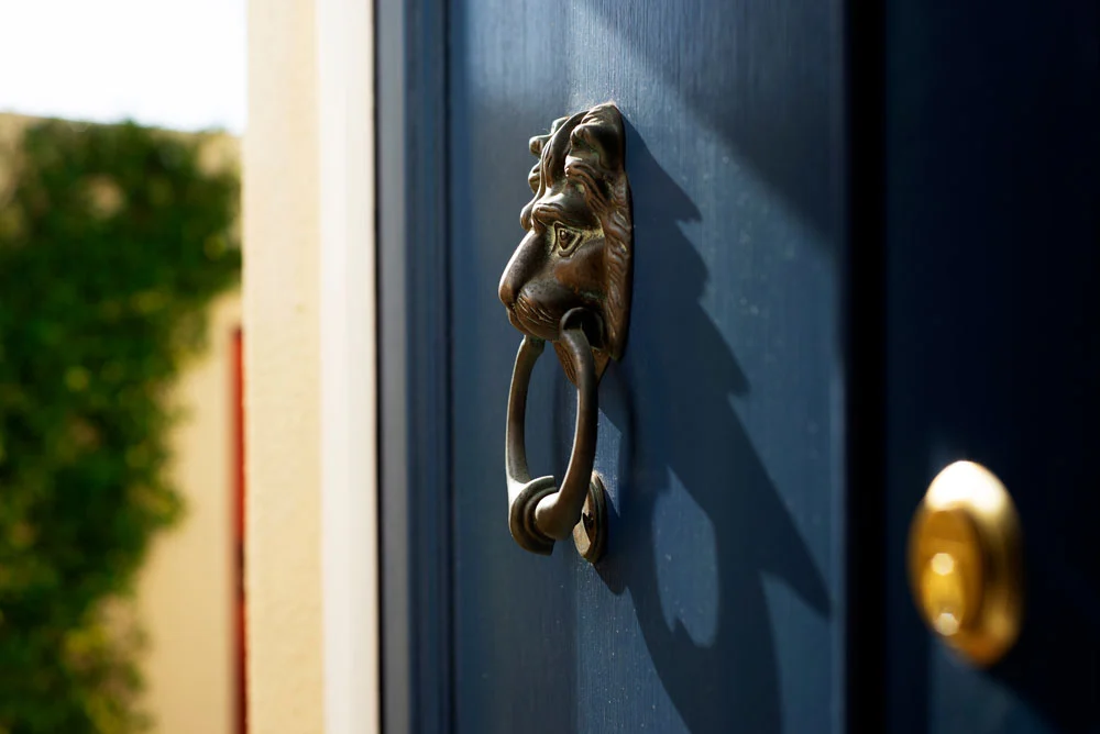 Luxury Real Estate lion symbol on door